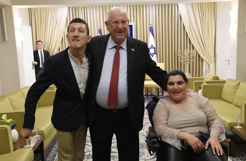 Eldar and Dina Yusupov with President Reuven Rivlin (photo credit: Mark Neiman/GPO)