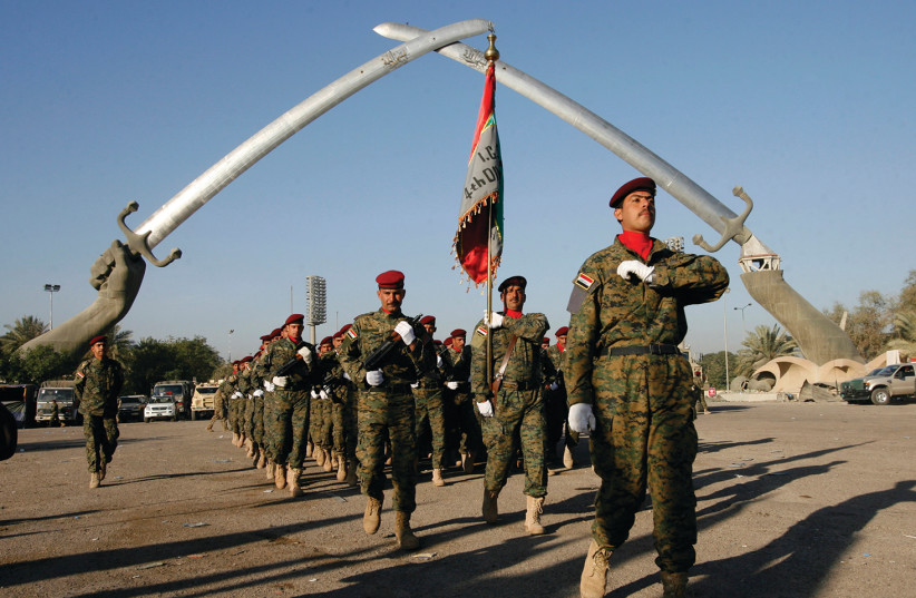 IRAQI SOLDIERS march during a rehearsal for Iraqi Army Day in Baghdad in 2009 (photo credit: REUTERS)