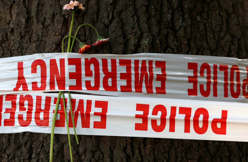Flowers are seen near the site of Friday's shooting, outside Al Noor mosque in Christchurch, New Zealand March 19, 2019 (photo credit: REUTERS/EDGAR SU)
