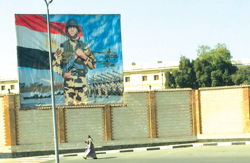 A POSTER touts Egyptian military might. (photo credit: SETH J. FRANTZMAN)