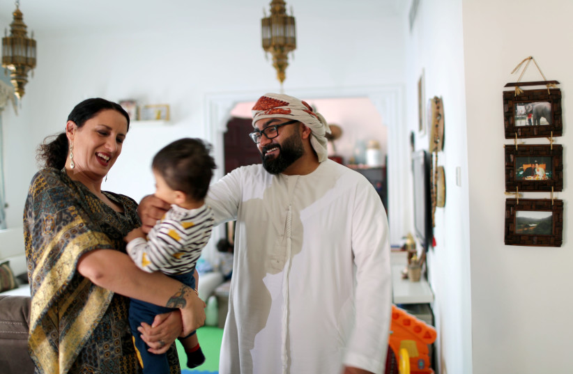 Ali al Sayed, local Muslim, and his wife Mina Liccione (photo credit: AHMED JADALLAH / REUTERS)