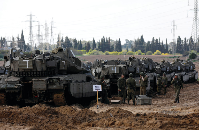 TANKS DEPLOYED near the Gaza border (photo credit: REUTERS)