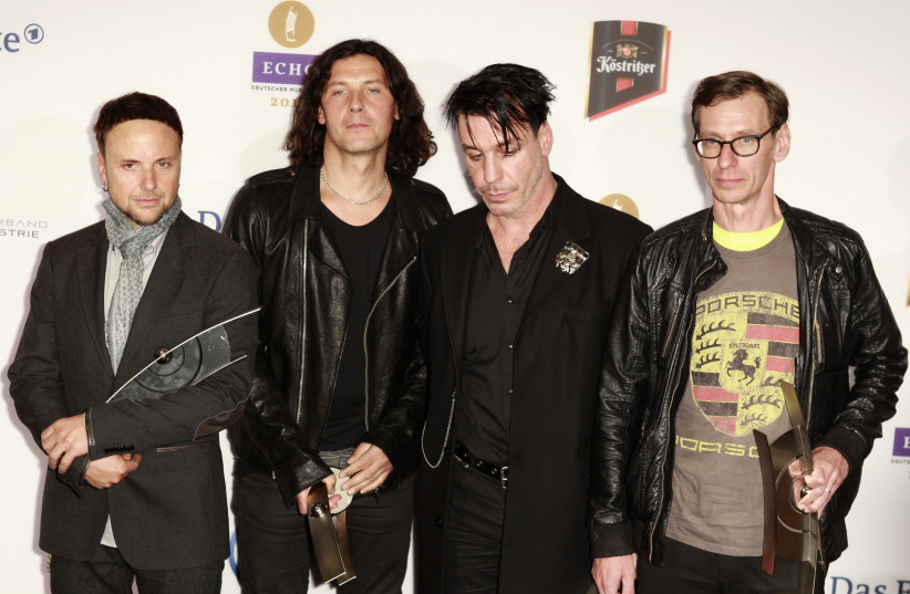 Members of German band Rammstein pose with their trophies at the Echo Music Awards ceremony in 2011. (credit: THOMAS PETER/REUTERS)