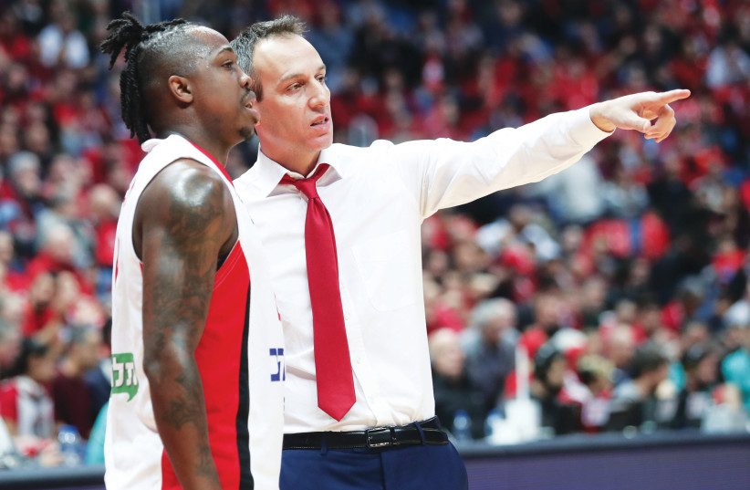 ODED KATASH (right) has excelled on the Hapoel Jerusalem sideline, especially in being able to earn the respect of – and relate to – his players, such as J’Covan Brown (left) (photo credit: DANNY MARON)