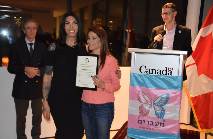 Yesh Atid MK Meirav Ben-Ari wins an award for her contribution to the Israeli trans community, 2019. (photo credit: ELLA FELICITY DORON/COURTESY THE CANADIAN EMBASSY)