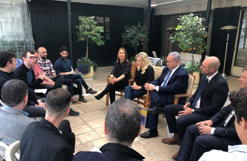 Prime Minister Benjamin Netanyahu (C) sits aside his wife, Sara, and Likud MKs Gila Gamliel and Amir Ohana, during a meeting with LGBT activists, April 7th, 2019 (photo credit: Courtesy)