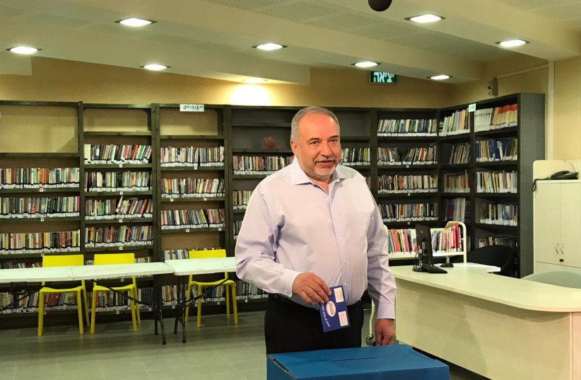Avigdor Liberman voting (photo credit: Courtesy)