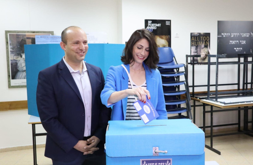 Naftali Bennett voting with his wife, Gila (photo credit: Courtesy)