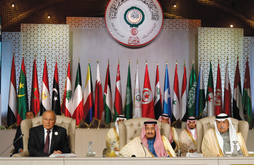 (FROM LEFT) Arab League secretary-general Ahmed Abul Gheit, Saudi Arabia’s King Salman bin Abdulaziz and Saudi Arabia’s Foreign Minister Ibrahim al-Assaf attend the 30th Arab Summit in Tunisia on March 31. (photo credit: REUTERS)
