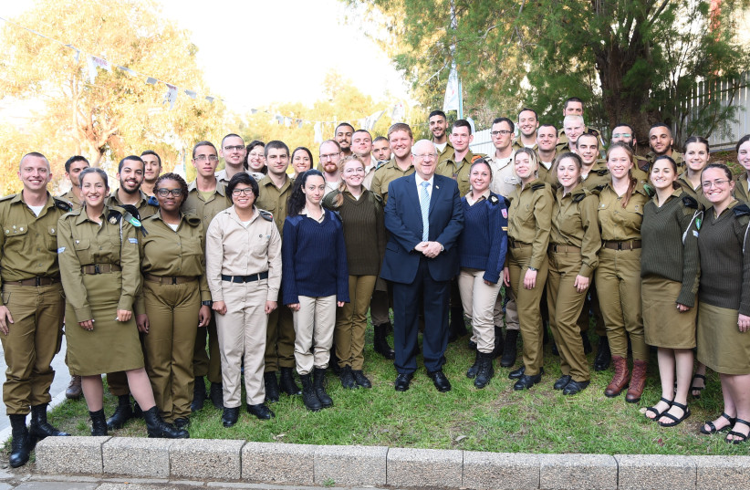 President Rivlin celebrating Pesach Seder with lone soldiers,April 19, 2019. (photo credit: TZALAMIM BE'KLIK)