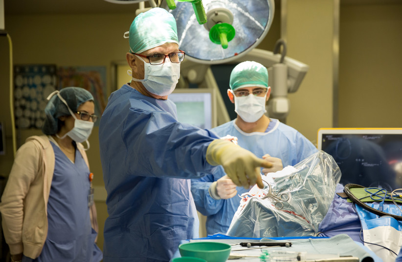 DR. NEVO MARGALIT directs a complex neurosurgery (photo credit: Courtesy)