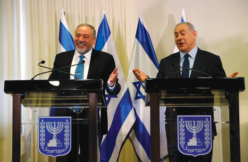 WILL THEY laugh again in a few weeks? Prime Minister Benjamin Netanyahu and Yisrael Beytenu chairman Avigdor Liberman (credit: REUTERS)