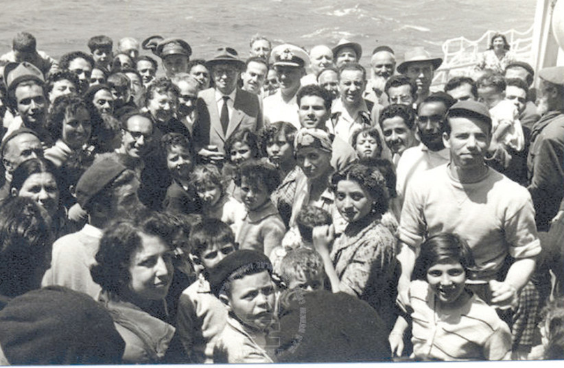 THEN-PRESIDENT Yitzhak Ben-Zvi and his wife Rachel Yana’it Ben-Zvi with new immigrants from North Africa, aboard the ship ‘Negba’ in 1955. (photo credit: ROBERT MILSHTOK/YAD BEN ZVI PHOTO ARCHIVES)