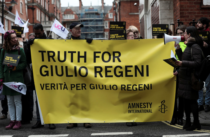 Demonstrators from Amnesty International hold placards outside the Egyptian embassy in support of Giulio Regeni, who was found murdered in Cairo three years ago, in London (photo credit: SIMON DAWSON/ REUTERS)