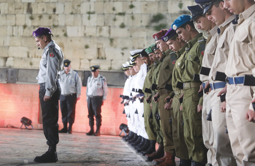 SOLDIERS STAND STILL as the memorial siren is sounded nationwide yesterday, during a ceremony marking Remembrance Day at the Western Wall. (photo credit: MARC ISRAEL SELLEM)