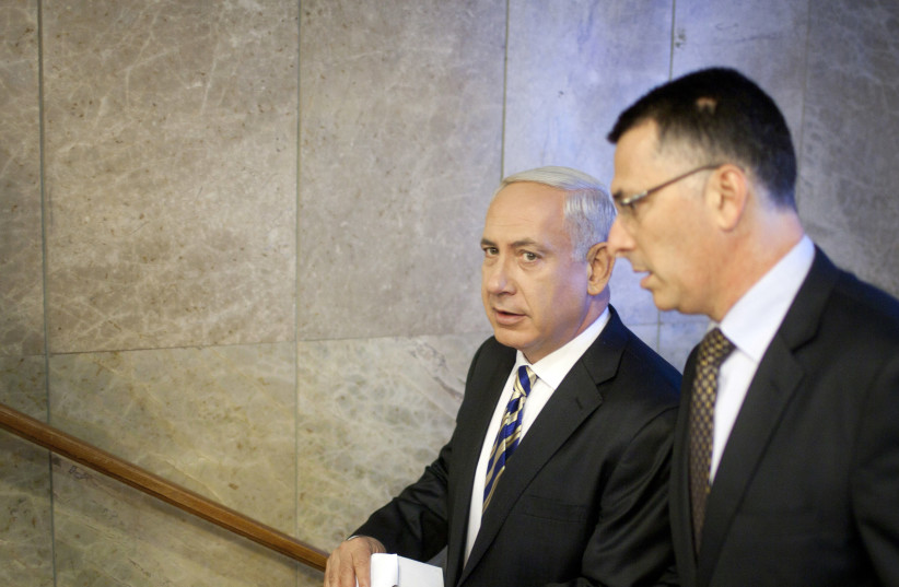 Israel's Prime Minister Benjamin Netanyahu (L) and then-Education Minister Gideon Sa'ar in 2012 (photo credit: URIEL SINAI/POOL/REUTERS)