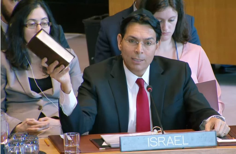 "This is the deed to our land," stated Danny Danon, Israel's ambassador to the United Nations as he read from the Bible at the Security Council, April 29, 2019 (photo credit: screenshot)