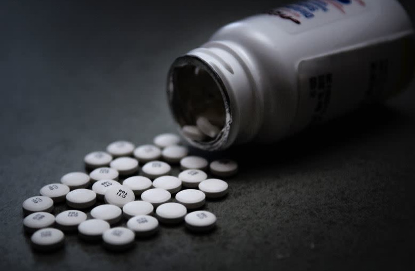 Prescription pain pills are dumped out on a table. (photo credit: U.S. AIR FORCE PHOTO ILLUSTRATION/TECH. SGT. MARK R. W. ORDERS-WOEMPNER)