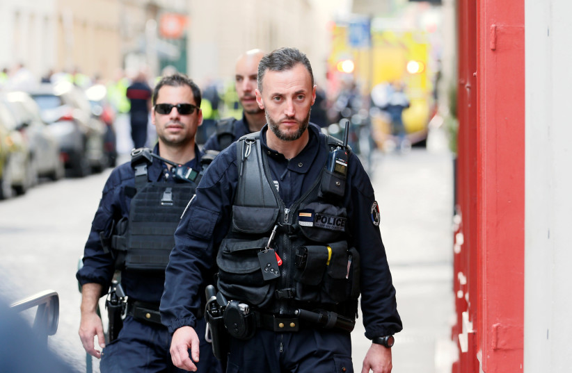 Police officers are seen near the site of a suspected bomb attack in central Lyon, France May 24, 2019. (photo credit: EMMANUEL FOUDROT/ REUTERS)