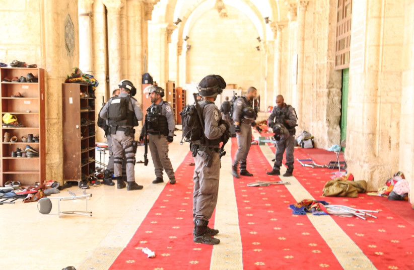 Chairs and objects thrown on the ground after Arabs rioted the decision to allow Jews to enter the Temple Mount on Jerusalem Day (photo credit: POLICE SPOKESPERSON'S UNIT)