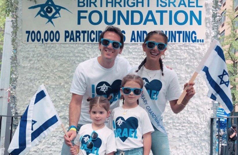Fashion blogger Elizabeth Savetsky, an Honorary Grand Marshal at the Celebrate Israel Parade in New York City, with her husband and daughters. (photo credit: HALEY COHEN)