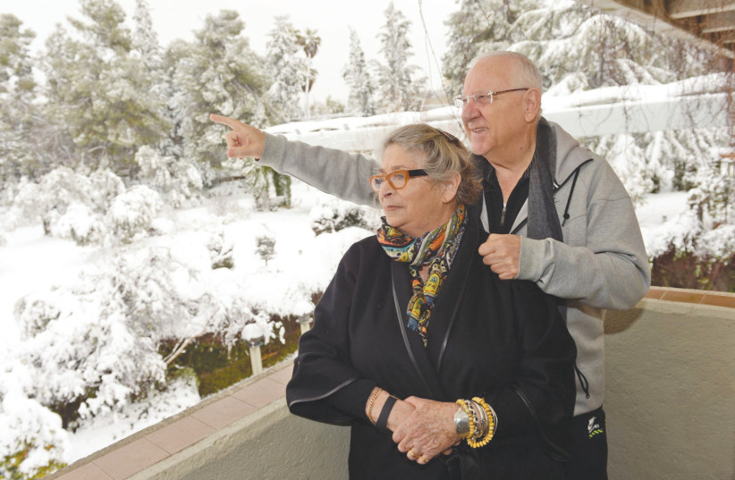 PRESIDENT REUVEN Rivlin and his wife, Nechama, enjoy the beauty of Jerusalem in the snow in February 2015.  (photo credit: HAIM ZACH/GPO)