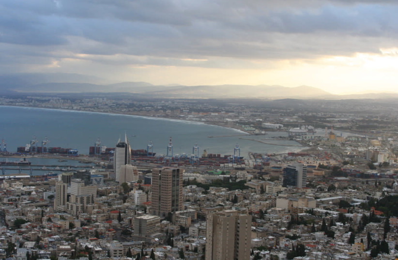 The sun rises over Haifa Bay, 2006. (credit: Wikimedia Commons)
