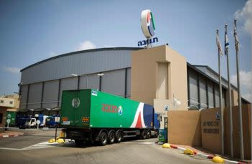 A Tnuva truck enters the company's logistic centre in the southern town of Kiryat Malachi, Israel May 22, 2014.  (credit: REUTERS/AMMAR ABDULLAH/FILE PHOTO)