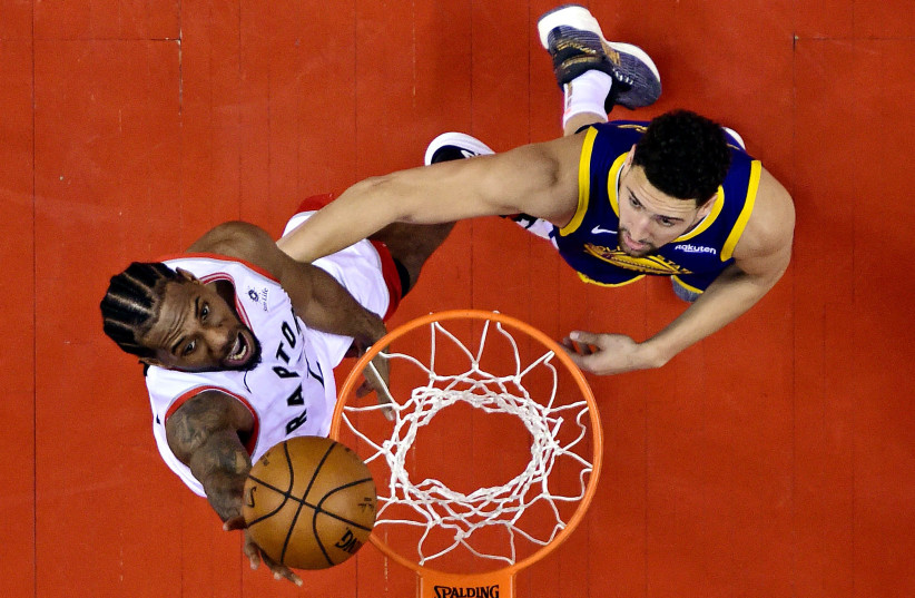 Toronto Raptors forward Kawhi Leonard (2) shoots the ball against Golden State Warriors guard Klay Thompson (11) in game five of the 2019 NBA Finals at Scotiabank Arena (photo credit: REUTERS)
