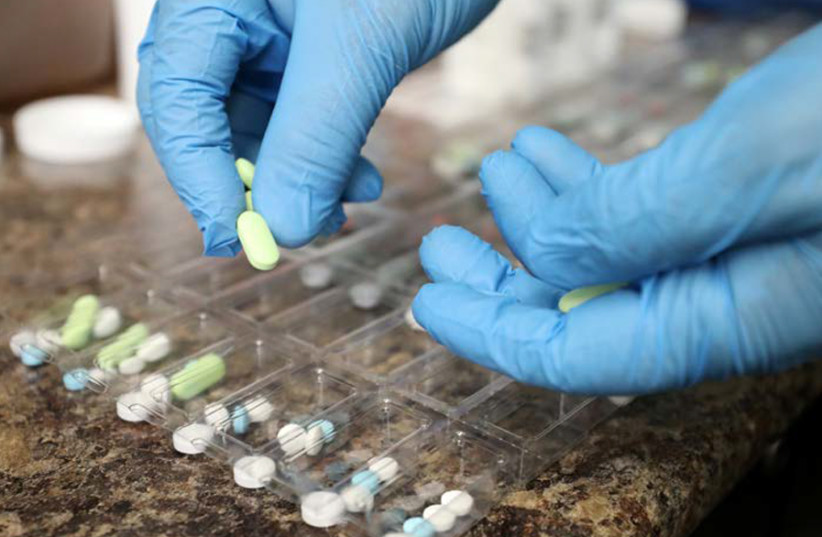 THE AUTHOR argues that drug companies work entirely to protect their own profits. (photo credit: REUTERS/CHRIS WATTIE)