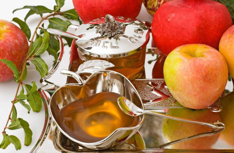 FOR SECULAR Israelis, the symbol for Rosh Hashanah is apples and honey – not the shofar. (photo credit: SUFECO/FLICKR)