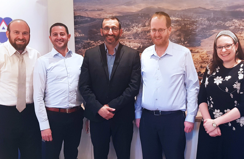 Yedidya and Sivan Rahav Meir, far right, pose with World Mizrachi head Rabbi Doron Perez and other leaders from the Jewish body. (photo credit: WORLD MIZRACHI)
