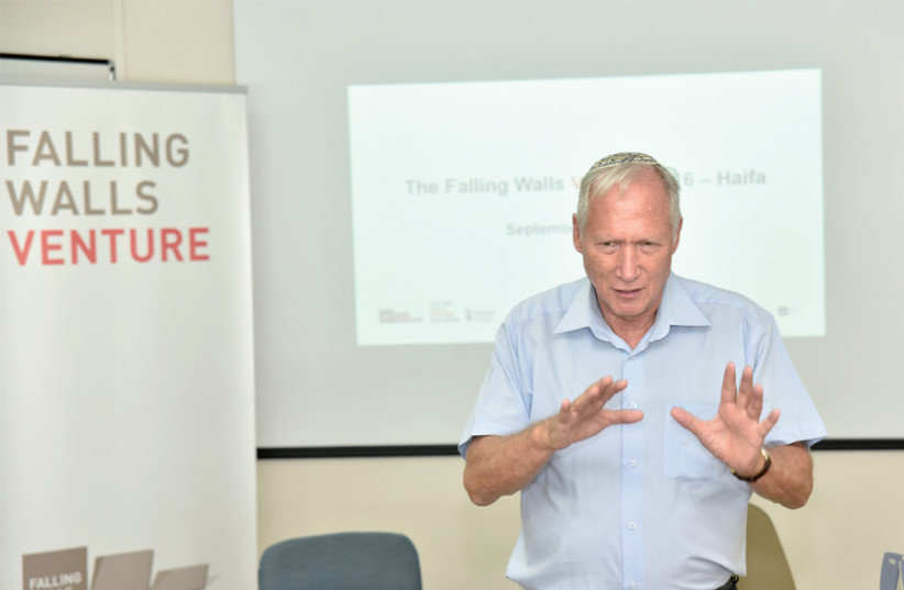 Rafi Nave addresses a conference of Falling Walls, an international platform for leaders from the worlds of science, business, politics, the arts and society initiated on the occasion of the 20th anniversary of the fall of the Berlin Wall (credit: Courtesy)