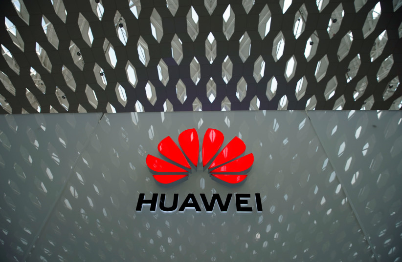 A Huawei company logo is seen at the Shenzhen International Airport in Shenzhen in Shenzhen (photo credit: ALY SONG/REUTERS)