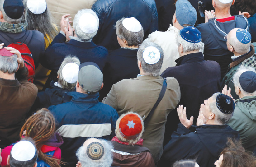 A kippah demonstration in front of a synagogue in Berlin (photo credit: REUTERS)