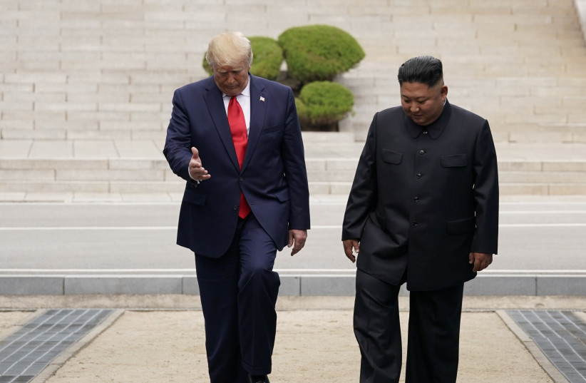 U.S. President Donald Trump meets with North Korean leader Kim Jong Un at the demilitarized zone separating the two Koreas, in Panmunjom, South Korea, June 30, 2019 (credit: KEVIN LAMARQUE/REUTERS)