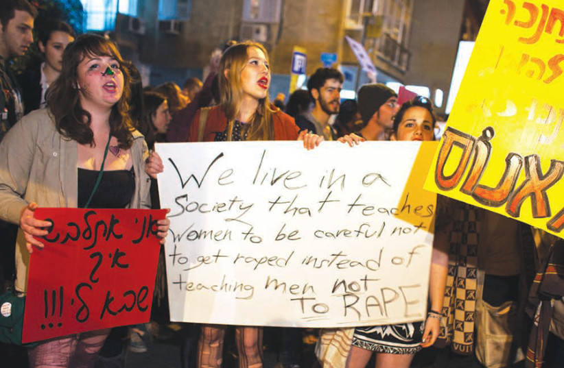 SILENT NO more: Women hold placards and shout slogans condemning discrimination against women based on their choice of dress or appearance, at the Tel Aviv ‘Slut Walk.’ (credit: NIR ELIAS / REUTERS)