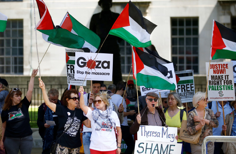 Pro-Palestinian demonstrators protest in London in June 2018.  (credit: HENRY NICHOLLS/REUTERS)