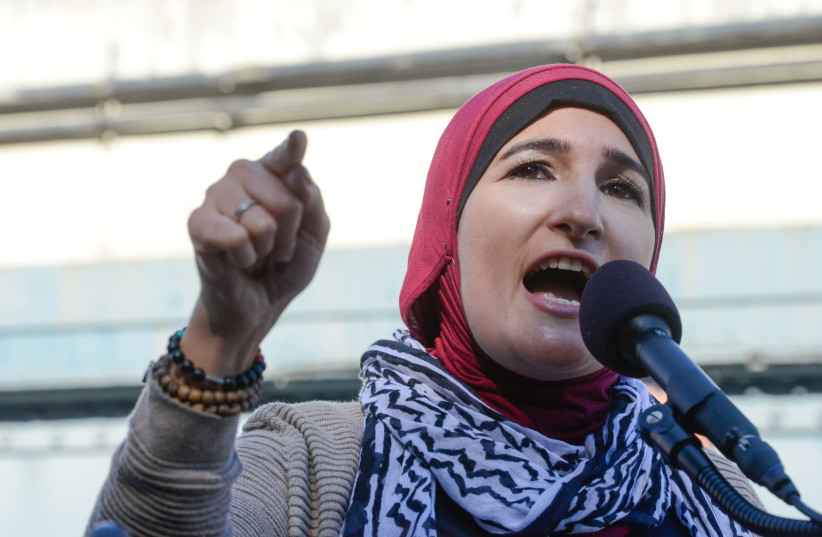 Activist Linda Sarsour speaks while people participate a protest called March for Racial Justice in New York City (photo credit: STEPHANIE KEITH/REUTERS)