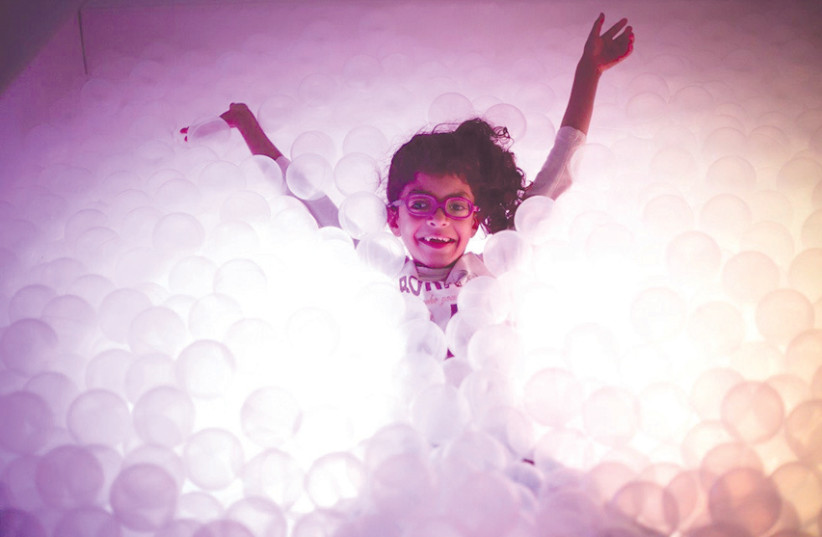 A CHILD plays in the sensory therapy room at Beit Issie Shapiro.  (photo credit: Courtesy)