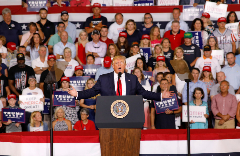 U.S. President Trump speaks about U.S. Representative Omar at campaign rally in Greenville (photo credit: JONATHAN DRAKE / REUTERS)