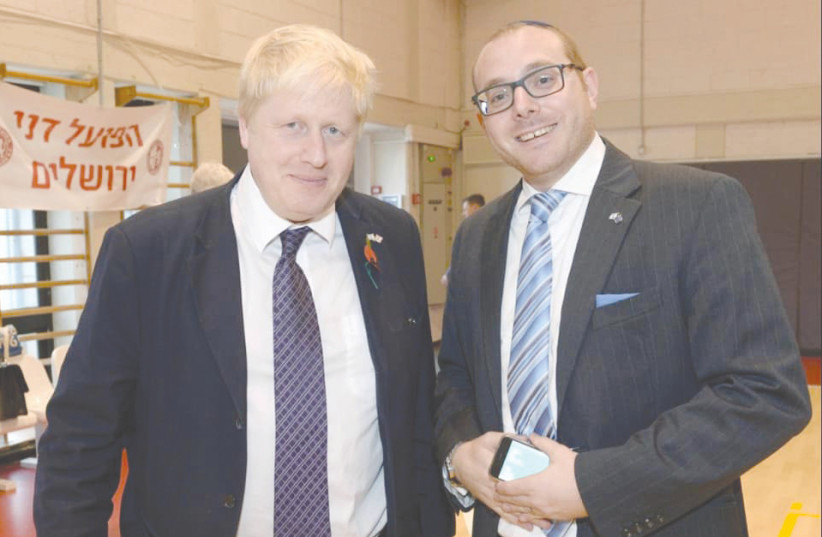 NEWLY ELECTED Prime Minister of England Boris Johnson with Jason Pearlman. (photo credit: HILLEL MEIR)