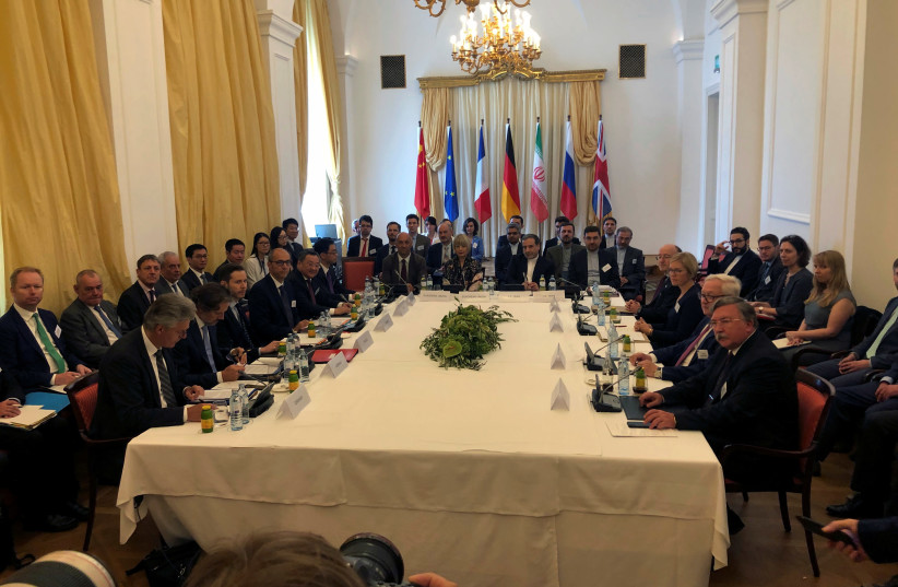 Iran's top nuclear negotiator Abbas Araqchi and EEAS Secretary General Helga Schmid attend a meeting of the JCPOA Joint Commission in Vienna, Austria to discuss the Iran nuclear deal (credit: REUTERS/KIRSTI KNOLLE)