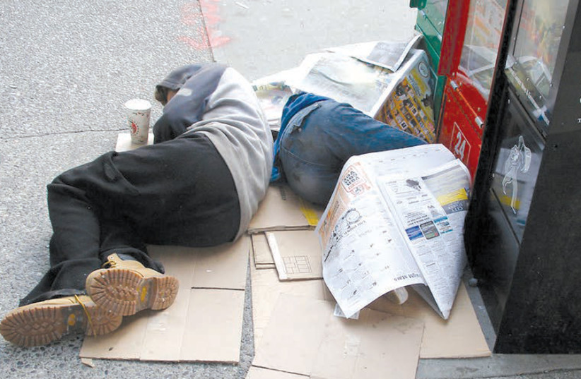 Homeless people sleeping on the sidewalk. (photo credit: FLICKR)