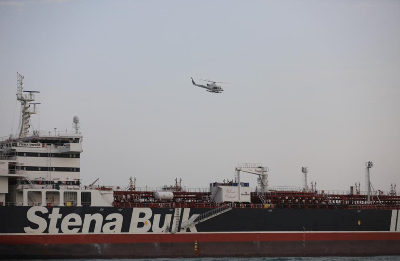 A helicopter of Iranian Revolutionary Guard flies over Stena Impero, a British-flagged vessel owned by Stena Bulk (photo credit: HANDOUT/REUTERS)
