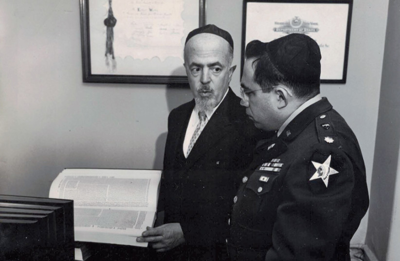 Rabbi Leo Jung presents US Army Chaplain Oscar Lifshutz with a set of the precious Survivors Talmud at Fort Slocum, New York, in 1952; Lifshutz served there as head of the Jewish Chaplains Training Center from 1951-56 (photo credit: US DEPARTMENT OF DEFENSE)
