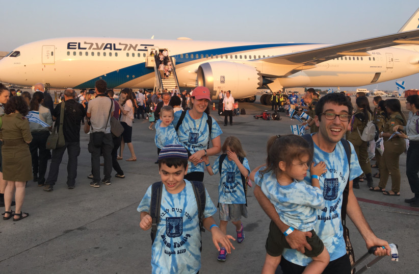 The Blum family steps off the chartered Nefesh B'Nefesh plane in Israel on Wednesday (photo credit: MENACHEM SHLOMO)
