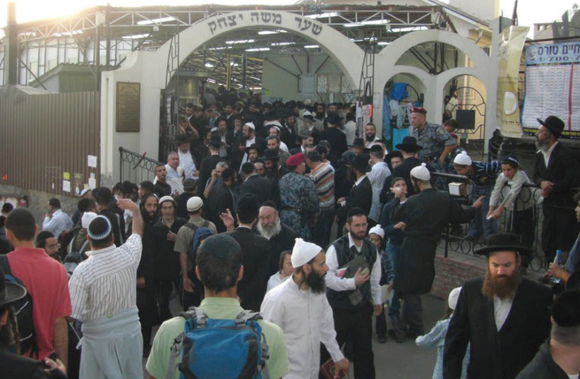 Jews are pictured making the pilgrimage to the grave of Rabbi Nachman of Breslov in Uman, Ukraine. (photo credit: Wikimedia Commons)