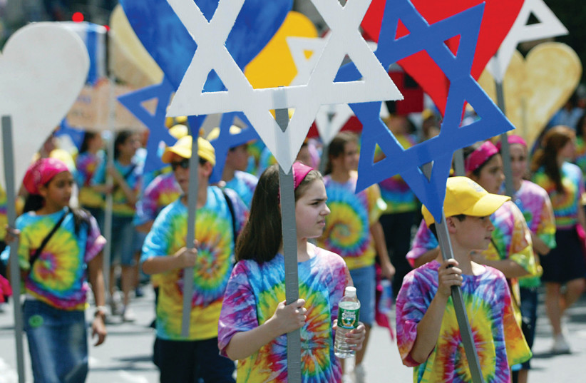 SUPPORTERS OF Israel at a parade in New York City in 2005. Fourteen years later, how have things changed? (photo credit: REUTERS)