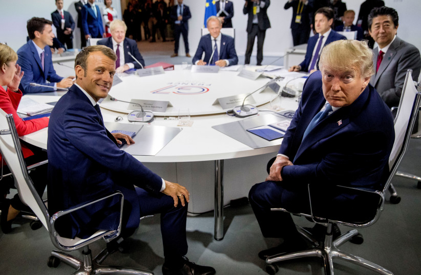 French President Emmanuel Macron and President Donald Trump participate in a G-7 Working Session on the Global Economy, Foreign Policy, and Security Affairs at the G-7 summit with German Chancellor Angela Merkel, Canadian Prime Minister Justin Trudeau and President of the European Council Donald Tus (photo credit: ANDREW HARNIK/POOL VIA REUTERS)